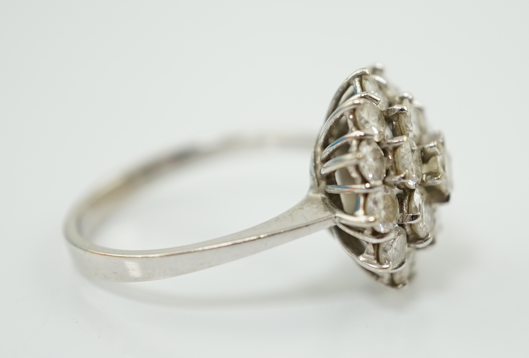 An 18ct white gold and diamond set flower head cluster ring